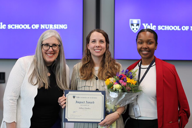 Hillary Dooley receiving the 2025 Impact Award