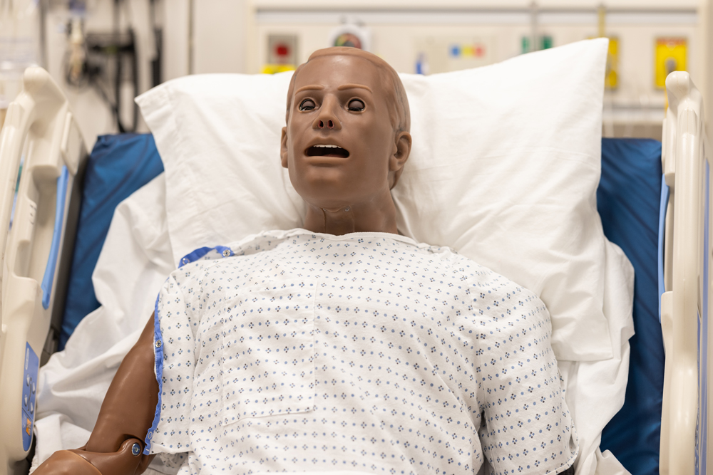 Super HAL, an adult patient simulator manikin, in a hospital bed