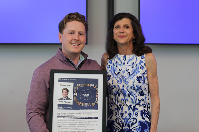 Mike Regan receiving an award for his innovative work on the Centennial, outstanding program management and his commitment to mentorship and collaboration