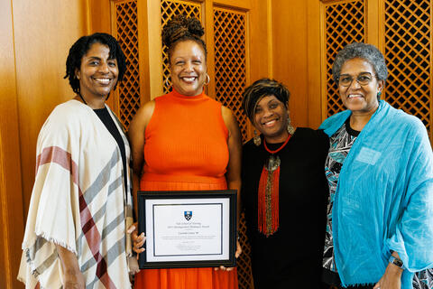 2023 Distinguished Alumni Award winner Lucinda Canty ’94 MSN enjoys the moment surrounded by well-wishers, including faculty member Heather Reynolds ’80 MSN (right).