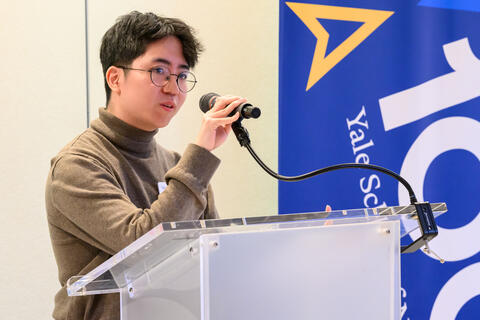 Austin Lee ’26 MSN reading his poem "Grief as a Circular Staircase" at YSN's 21st annual Creative Writing Awards