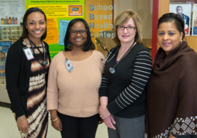 From left: Vanessa Reid ’05 MSN, Regina Felder, Alison Moriarty Daley, and Carla Giles all embrace their roles within an SBHC.