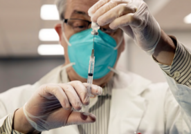 CVS Pharmacist Gerard Diebner prepares covid-19 vaccines for nursing home residents at Harlem Center for Nursing and Rehabilitation in New York City on Jan. 15. (Yuki Iwamura/AP)