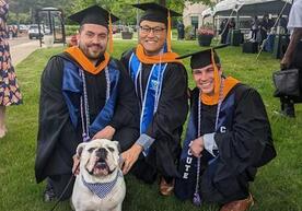 Luis Vera '23 MSN at Commencement in May with YSN friends and Handsome Dan.