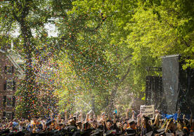 YSN students celebrating commencement with confetti 