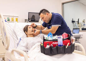 Gustavo Carrillo brings medical manikins to life in the Simulation Lab. Photo by Robert DeSanto. Gustavo Carrillo brings medical manikins to life in the Simulation Lab. Photo by Robert DeSanto.