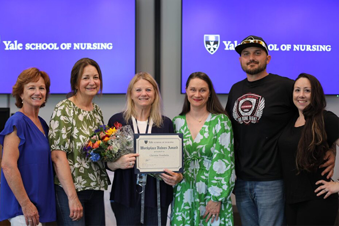 Christine Trombetta receiving the 2025 Workplace Values Award